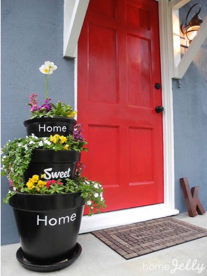 Stacked planters create welcoming doorway Stacked planters create welcoming doorway