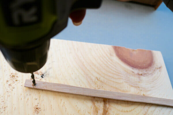 Drill hole in wooden photo holder pieces