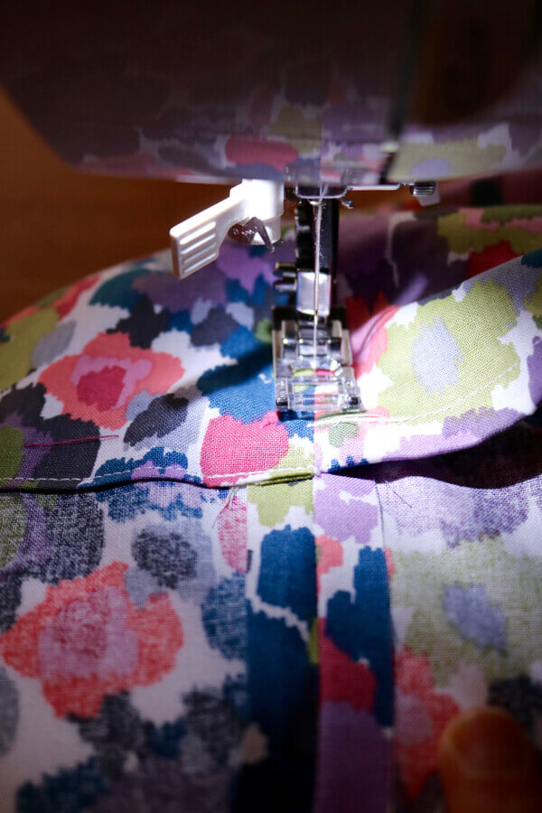 Sew on top of side seam to hide the stitch and secure the pillow overlap