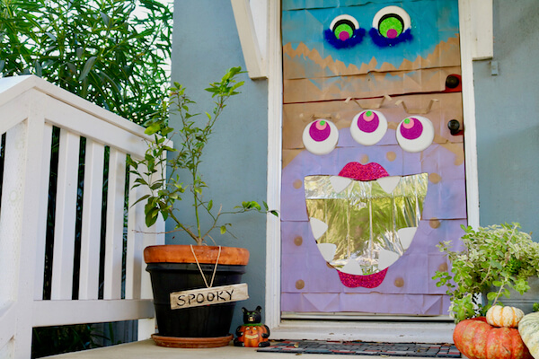Your Monster Mash door decoration has a mirrored mouth for Trick-or-Treaters!