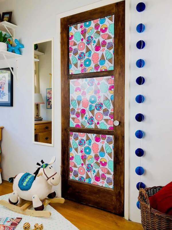 Adding removable wallpaper to paneled doors creates a natural frame for fun designs like this Candy, Donuts, Sweet Ice Cream paper