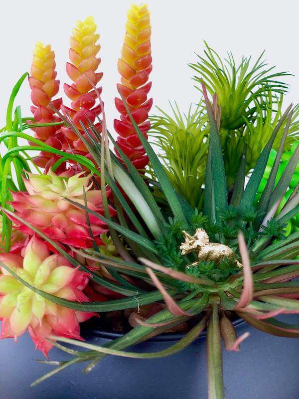 Floral decor detail adds whimsy and personality to your succulents