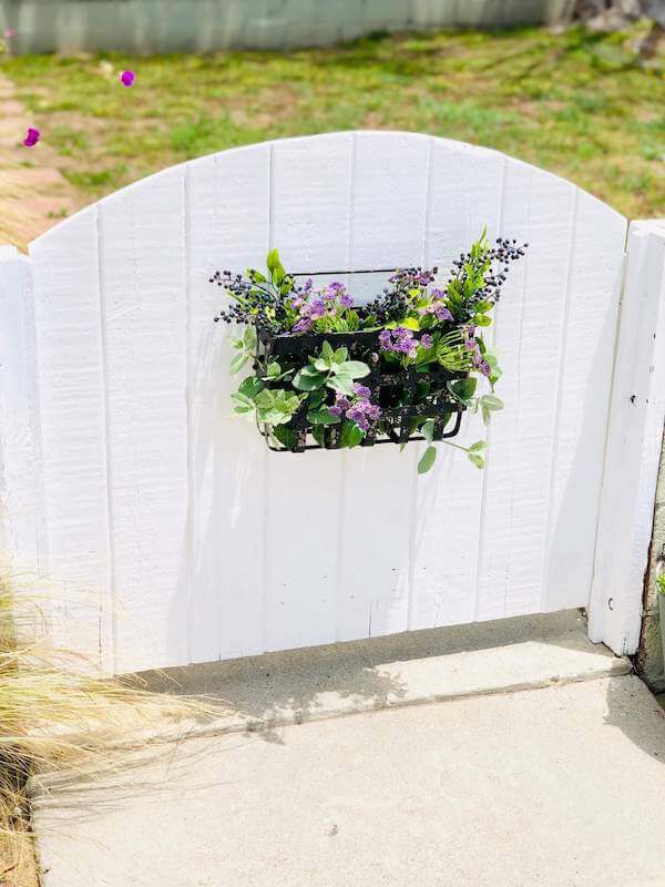 Freshened up garden gate with flowers