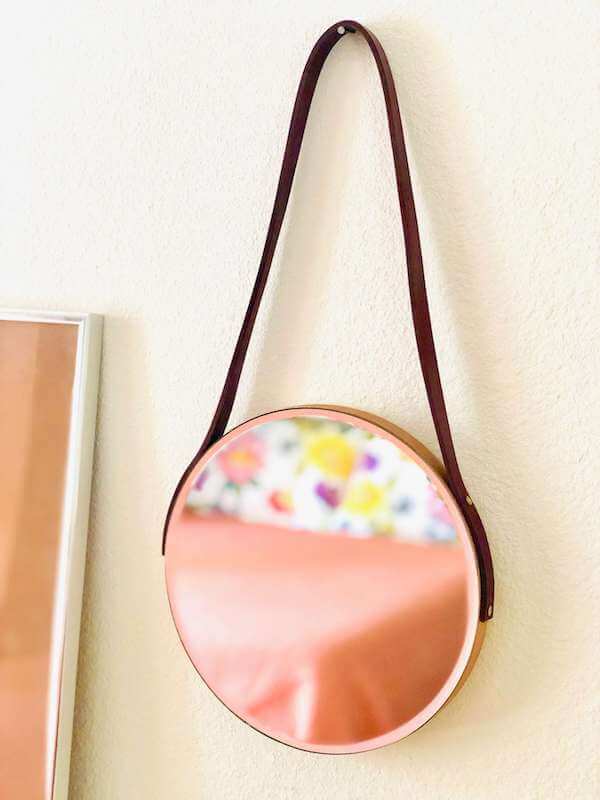 Leather strap hanging mirror - close-up portrait