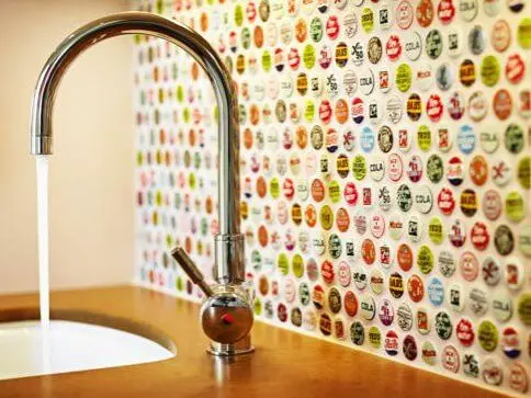 https://www.homejelly.com/wp-content/uploads/2012/03/bottle-cap-backsplash-e1341796892684.jpg