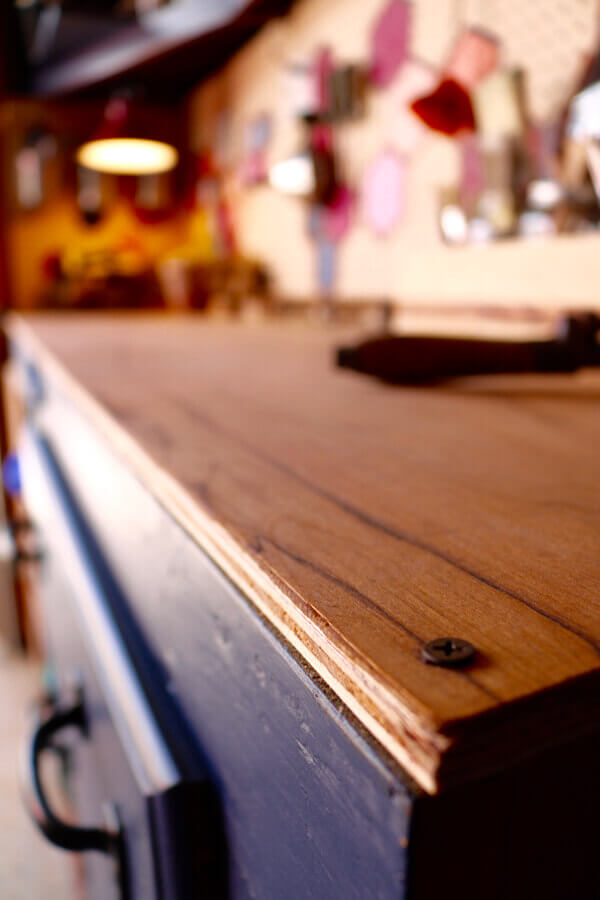 Wood grained workbench top is rich and perfect for tinkering upon