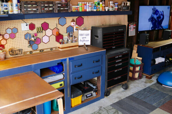 Workbench, folding table and gym cabinet now match and unify the entire garage space 2