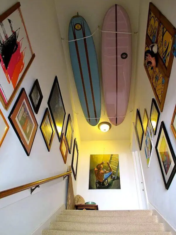 Staircase gallery with surfboard ceiling