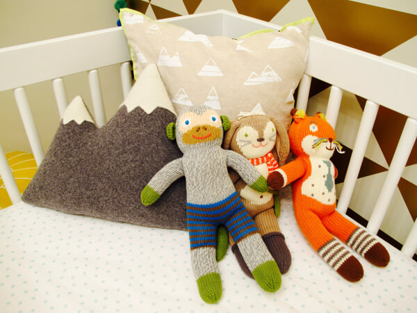 Posh, plush toys raise the nursery decor bar and are easily removed during sleepy-time