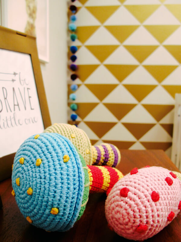 These crocheted rattles give soft texture to a dresser as well