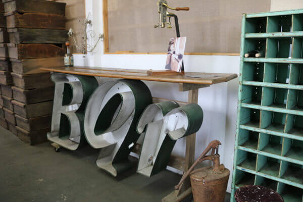 Vintage letters decorates this fun custom bar with cork extractor