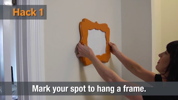 One of five fresh toothpaste home hacks - marking a spot to hang a frame