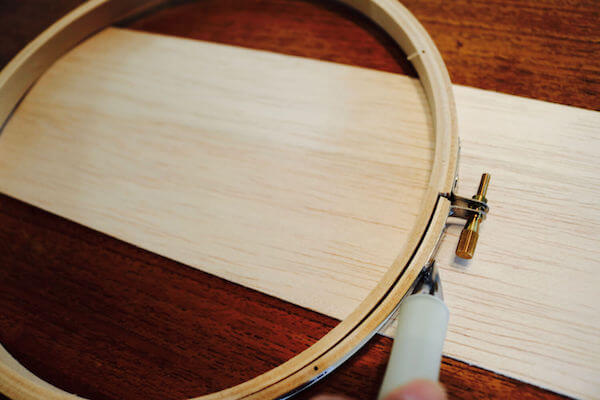 To add a light, trace the outer ring onto balsa wood, then cut with a scissors