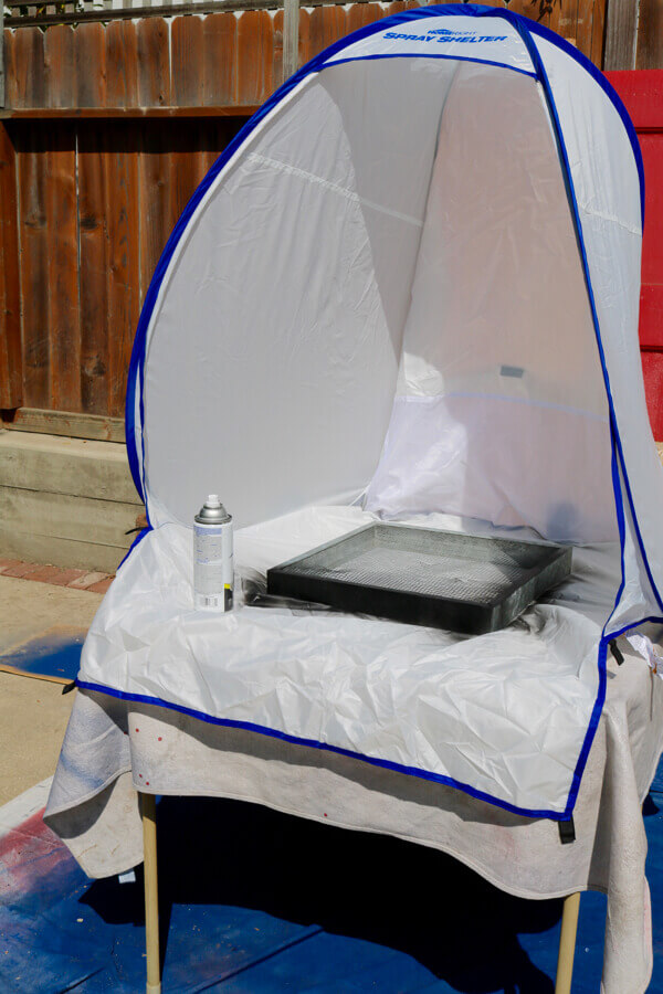 The HomeRight small spray shelter perfectly fits on a card table