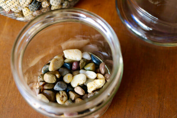 This was a salsa jar cleaned then bottom filled with pebbles