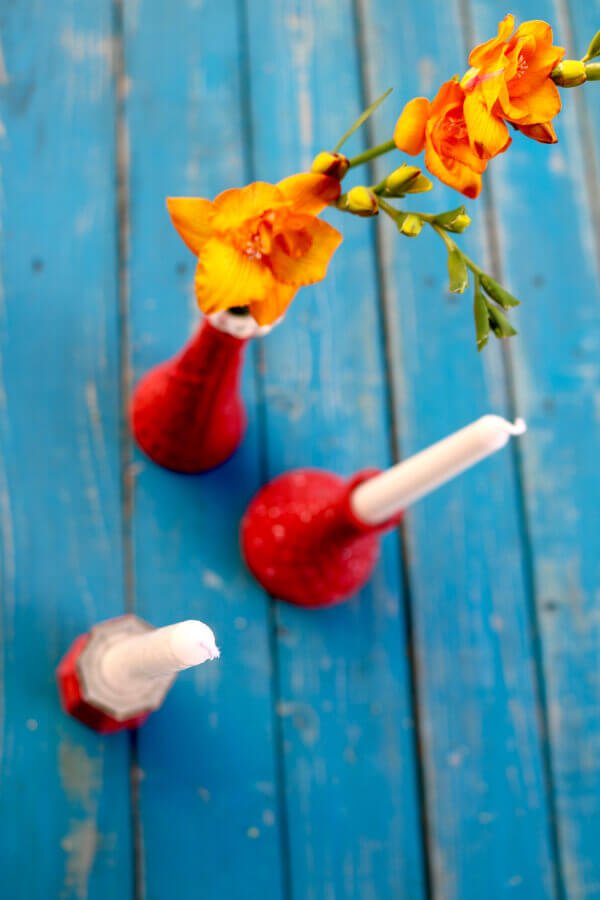 Flowers and white candles go with any color