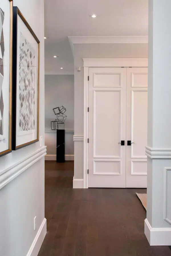 Atmosphere Interior designed doors update and coordinate with this room's trim and molding