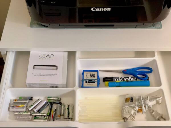 Besides added furniture like this flat file cabinet, you can add drawer inserts to keep small items organized