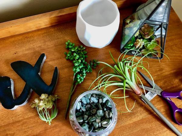 Add faux greenery, like these succulents, that require little to no maintenance