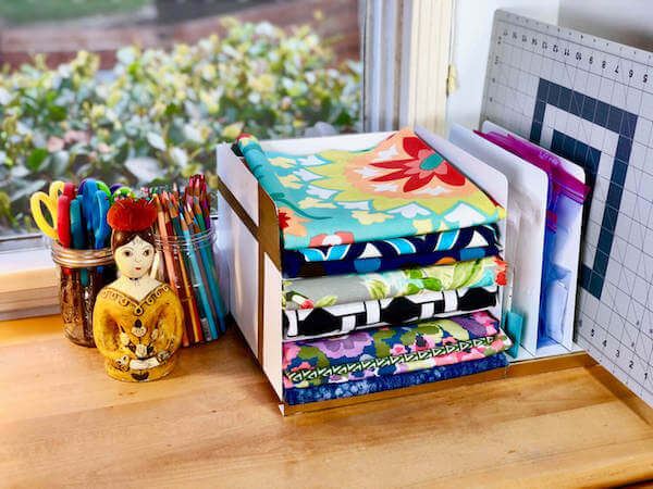 Revived desk paper organizer makes a perfect fabric display as well