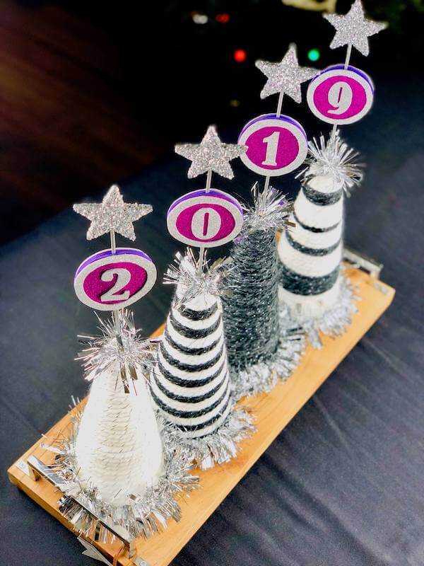 Ring in the new year with a fun pop'n hats centerpiece like this one!