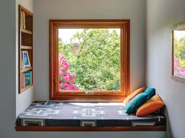 Casement windows offer picture views with a breeze like this sweet window seat nook. photo credit: Milgard's Essence series.