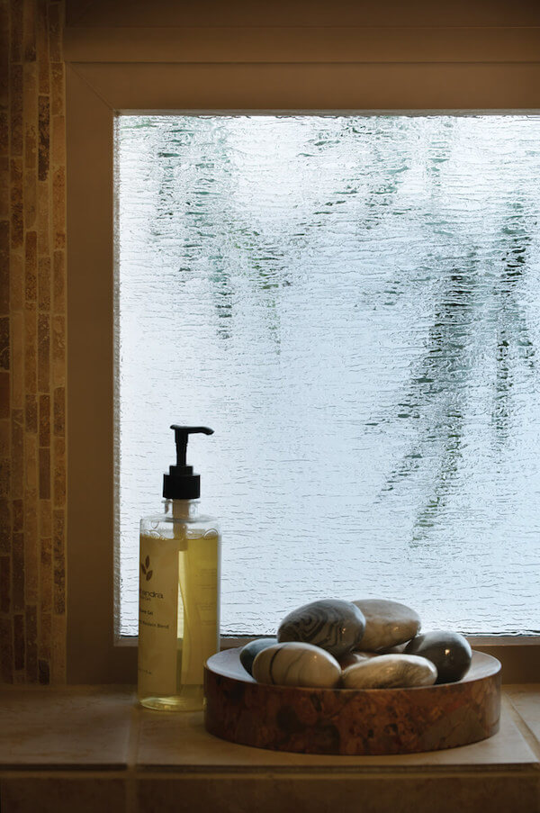 Obscure glass like this Rain style gives privacy and light to a space.