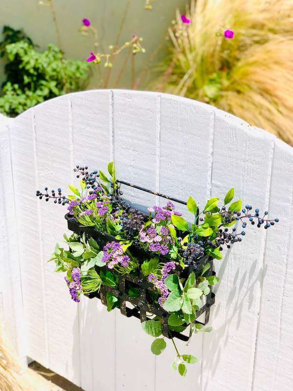 Refreshed garden gate with floral basket...cuteness, check!