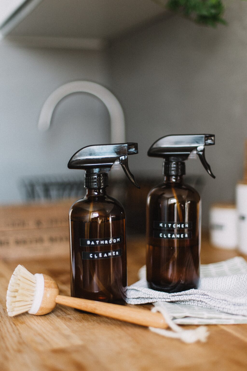 Two brown glass bottles of homemade cleaner